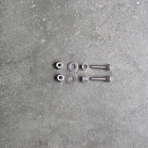 Bolt, spacer, washer, and nut ready for install.