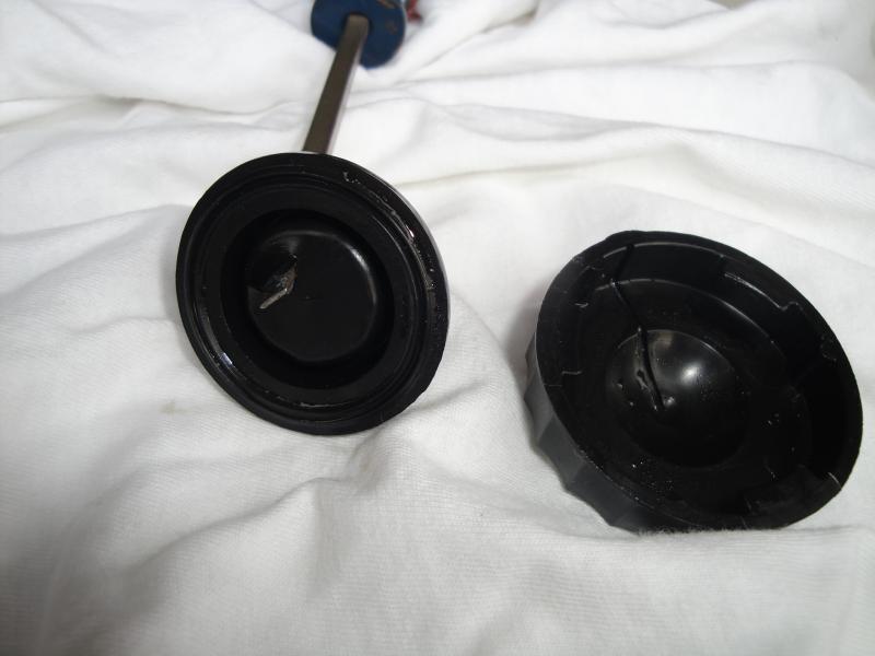 Brake fluid reservoir cap and seal with hole.