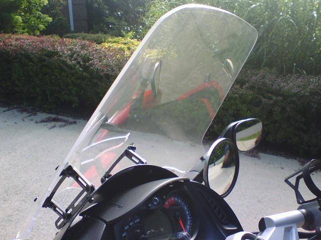 RoboBrackets From Madstad Engineering.  Used with my Cal-Sci 23 & 1/2" windscreen.  I love it during warmer weather.  During the Winter I use BRP's 25